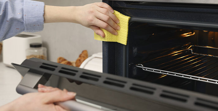 Professional cleaning of an oven as part of residential and commercial cleaning services in Phoenix.