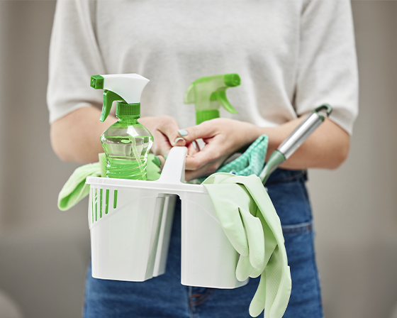 A green cleaning kit with supplies for professional residential and commercial cleaning services in Phoenix.