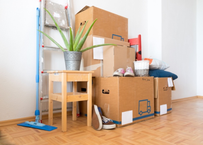 Packed boxes and cleaning supplies for move-in or move-out cleaning services in Phoenix.